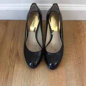 Black patent leather pumps